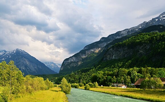 River Aare flowing through an alpine valley near Meiringen, Interlaken-Oberhasli, Bern, Switzerland