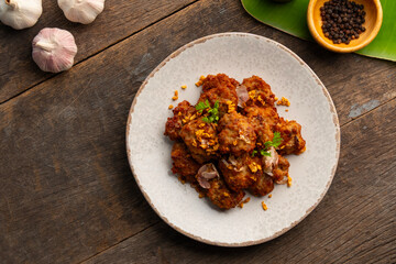 Fried Pork Balls(minced pork) with Garlic and Pepper in white plate.Top view.