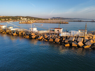 Obraz premium Aerial view of the traditional trabucchi on the pier of the port of Giulianova in Abruzzo.