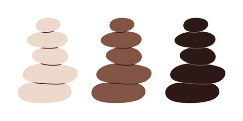 Set of stacked Zen stones cairns in earthy colors. Great for spa, meditation, and wellness design.