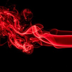Fototapeta premium A vibrant stream of crimson smoke gracefully curves against a stark black backdrop, creating an elegant and dynamic abstract composition