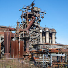Industrial giant stands against a clear blue sky