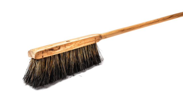 Wooden broom with natural bristles on a white background for cleaning purposes in homes, offices, and outdoor spaces