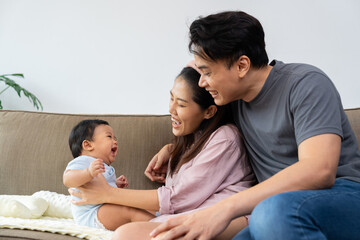 A loving parent embraces their infant, sharing warmth and innocence in a moment of deep connection. This happy family cherishes parenthood, strengthening their relationship through beauty of parenting
