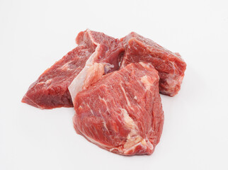 Raw Beef Chunks on White Background for Kitchen, Butchery, and Cooking Imagery