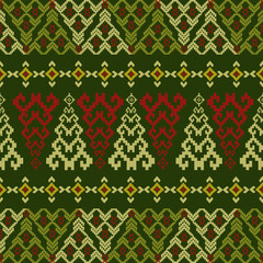 Seamless Christmas diamond pattern inspired by Nordic knitting style, featuring red and green geometric motifs on a white background. Perfect for winter fabric, holiday wrapping, and festive textile. 