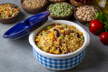 Bulgur pilaf with legumes; with peas, beans and corn kernels.