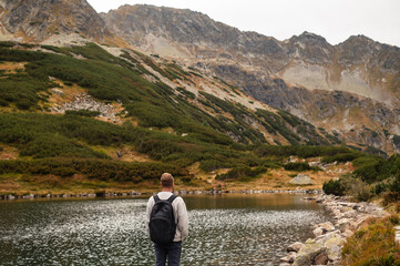 Hiker by Mountain Lake