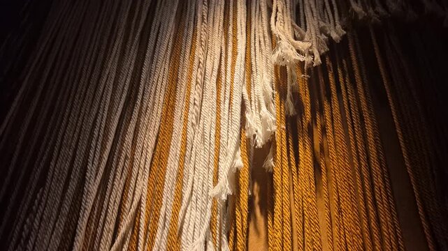 Decorative braided ropes or threads on the wall, close-up