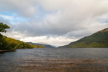 A cloudy, autumnal HDR image of Loch Lomond looking north taken from Firkin Point picnic site near Inverbeg, Scotland. 