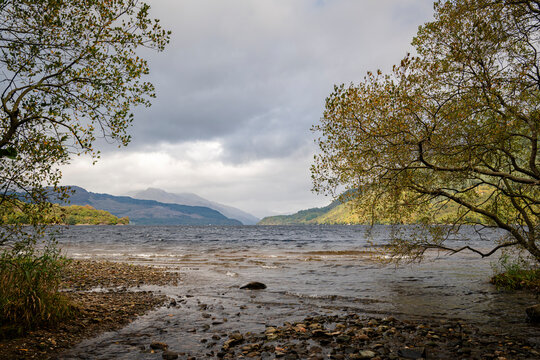 A cloudy, autumnal HDR image of Loch Lomond looking north taken from Firkin Point picnic site near Inverbeg, Scotland. 