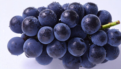 Fresh Juicy Black Grapes with Water Droplets on a Light Background Highlighting Their Texture