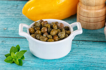 Pickled canned capers in the bowl