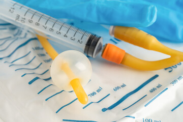 Foley catheter and urine drainage bag collect urine for disability or patient in hospital.