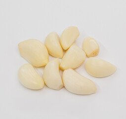 Pile Of Fresh Garlic Cloves On White Background For Cooking And Food Preparation