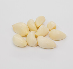 Pile Of Fresh Garlic Cloves On White Background For Cooking And Food Preparation