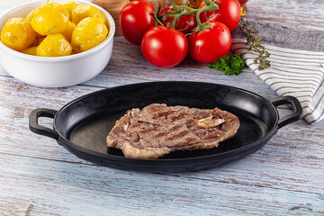 Grilled lamb steak with bone