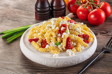 Italian pasta fusili with curd