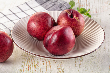 Ripe sweet juicy nectarines heap