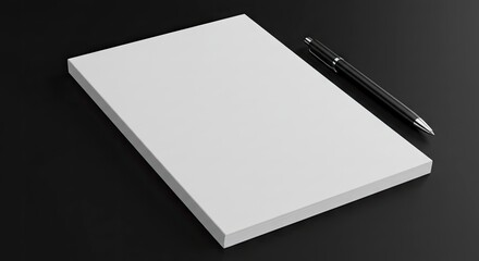 A stack of blank paper sits on a black surface with a pen lying alongside it