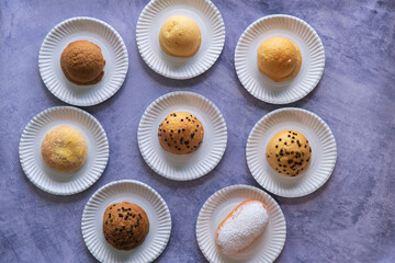 Modern bakery with many ingredients such as wheat flour, sugar, eggs, grains, fruit, butter, milk.