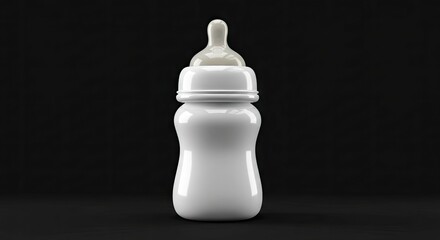 A white baby bottle with a nipple against a black background
