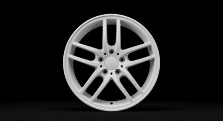 Obraz premium A white car rim on a black background center focus