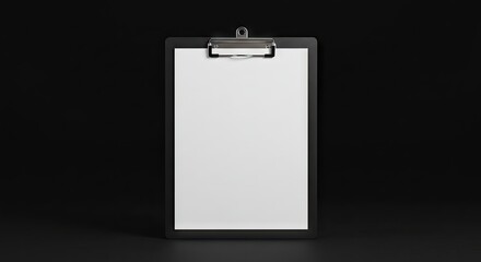 Clipboard with paper stands against a black backdrop