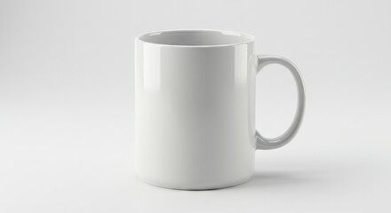 Fototapeta premium A white ceramic mug stands on a white surface in a studiolit setting