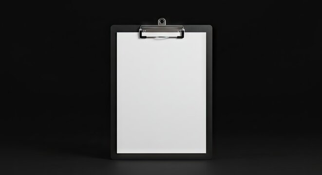 Clipboard with paper stands against a black backdrop