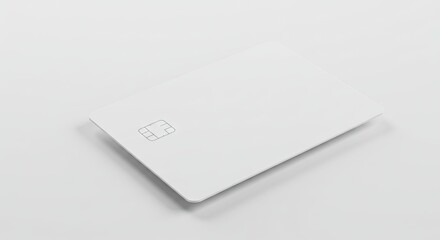 White credit card with a visible chip sits diagonally on a white surface