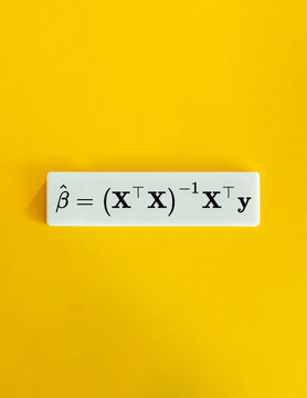 Ordinary Least Squares OLS Formula on White Tile over Yellow Background &ndash; Minimalist Economics and Statistics Concept