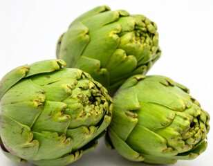 Obraz premium Two fresh raw artichokes isolated on white background. Top view.