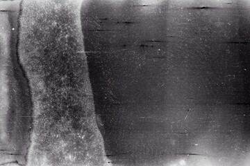 Blank grained film strip texture background with heavy grain, dust and light leak. Old expired moldy photographic film scan.