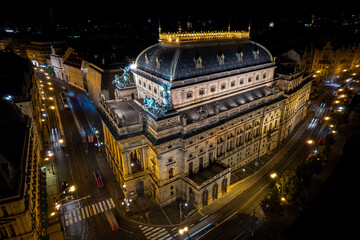 Beautiful Aerial view of Pragues National Theatre (Národní divadlo) at night with view of the city and the Vltava