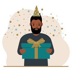 A man with a festive cap holds a large gift box with a bow.