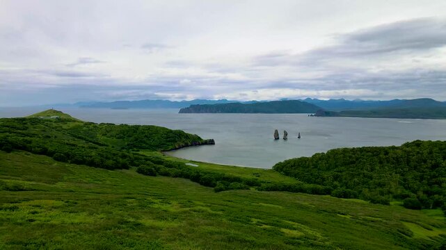 Kamchatka aerial panorama of Three Brothers rocks and coastline in Avacha Bay, Russia.
