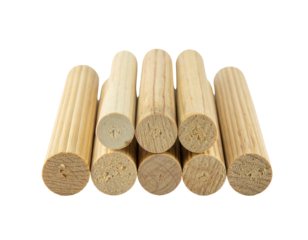 Close-up of wooden dowels arranged, showing end grains and ribbed cylindrical sides