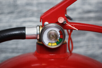 The manometer of powder extinguisher. Macro focus on gauge in normal green zone.