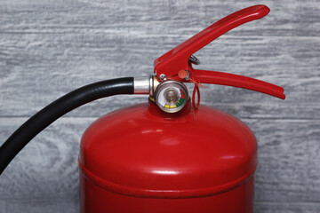 The red powder extinguisher with manometer. Closeup view.