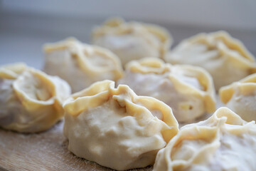 Homemade raw manti dumplings ready to be cooked for sale