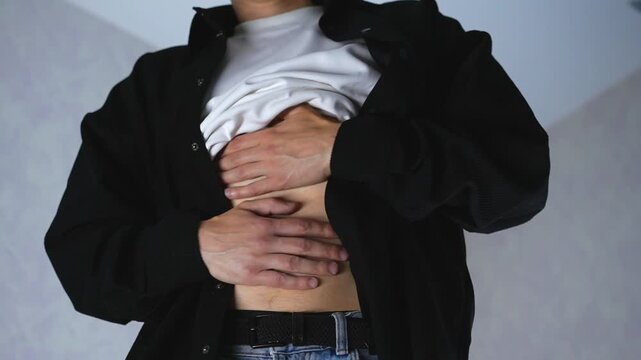 A person with a stomach cramp.
Intestinal infection and stomach pain.
Food poisoning and acute stomach pain.
A man holding his sore intestines.