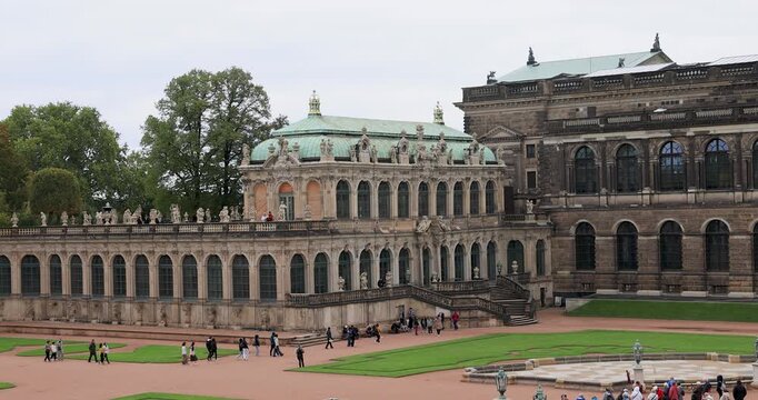 Dresden Germany Zwinger palace courtyard tourism 4K. Industrial center of East Germany, now unified German, European Union (EU) and NATO. Total destruction in WW II. Palace rebuilt historically.