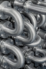 Curved stainless steel pipes, part of industrial cooling system