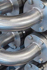 Curved stainless steel pipes, part of industrial cooling system