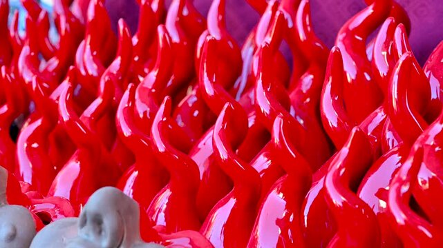 Naples, Italy, December 27, 2024. Footage of Via San Gregorio Armeno, showing a stall selling lucky horns. The bright red color catches the eye. Tourist attractions.