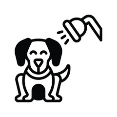 A seated dog is being showered by a shower head