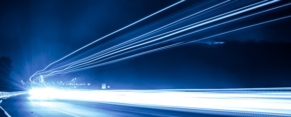 blue car lights at night. long exposure