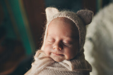 A newborn baby is wrapped in diapers with a wool cap in a basket. Swaddling, maternity hospital, family, ivf, life planning, parenting. A mother's love for her child. Baby food. High quality photo