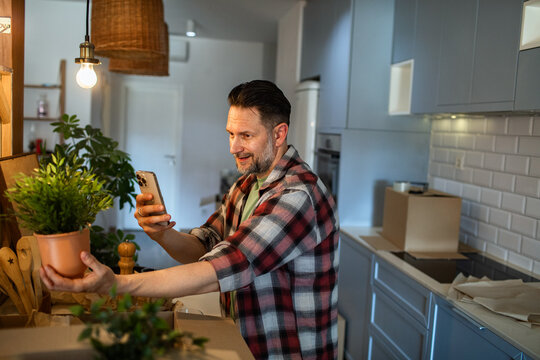 Man unpacking in new kitchen